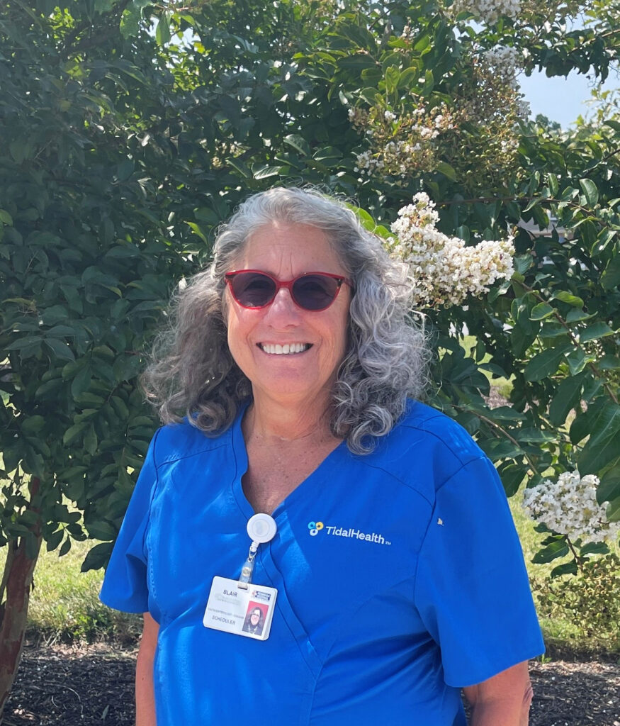 Female nurse in blue scrubs