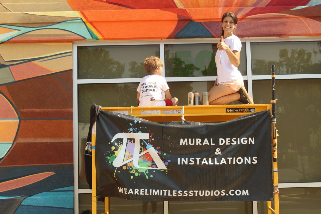 Family painting a mural