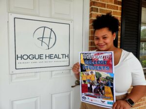 young girl holding a flyer