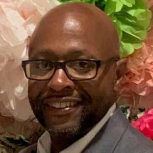 Headshot of a man in a suit