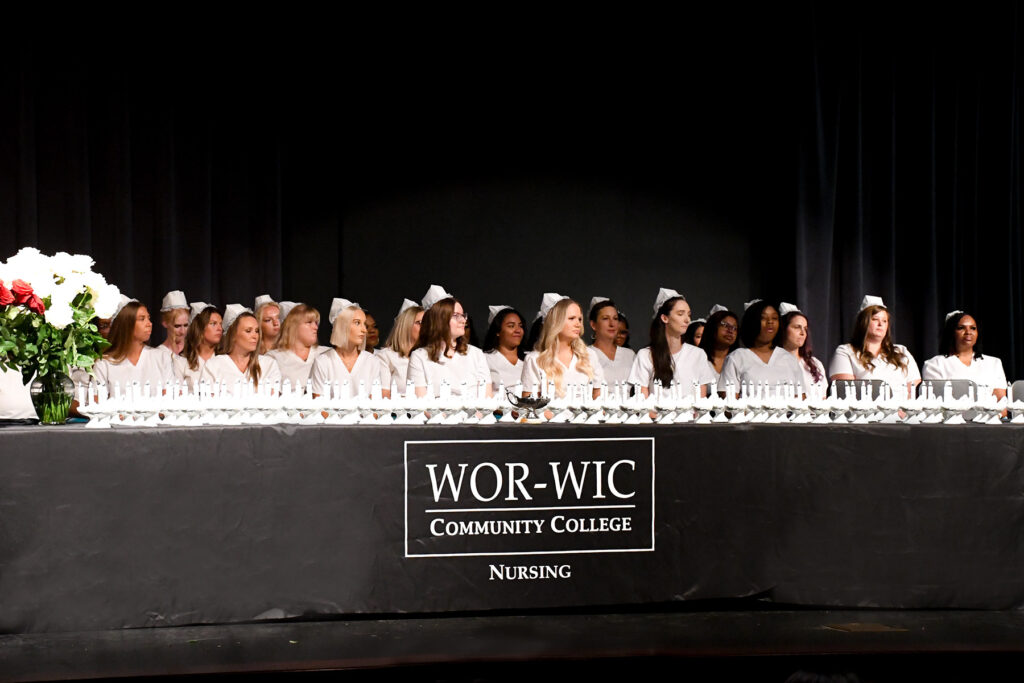 Wor-Wic Community College nursing graduates await their pins on stage