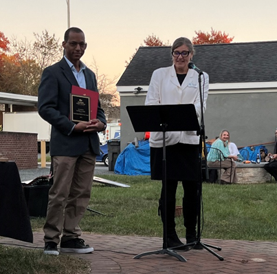 two people recieving an award