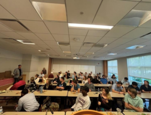 A group of people sitting in a classroom