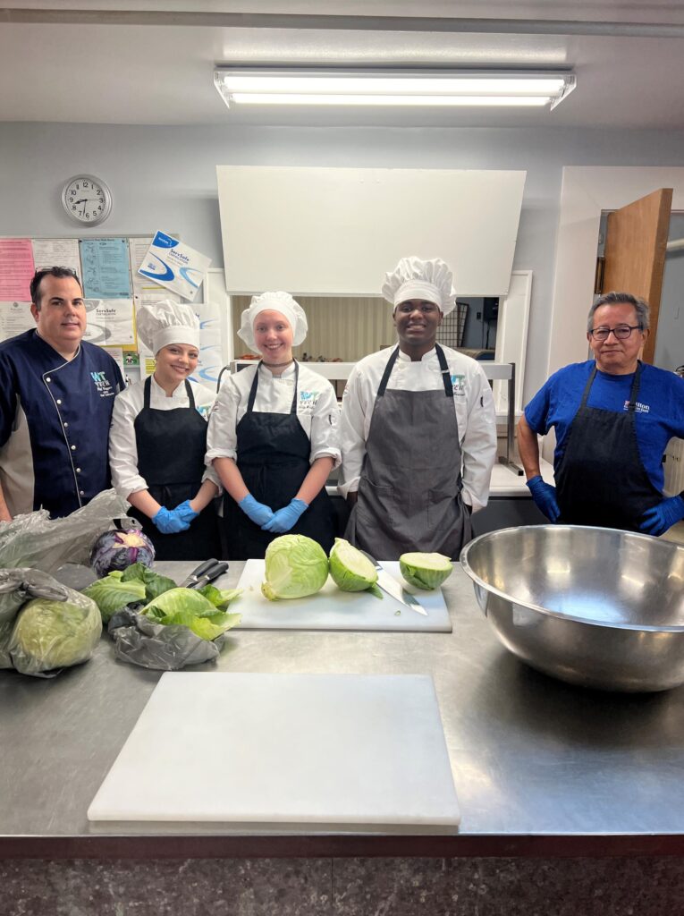 group of people in kitchen