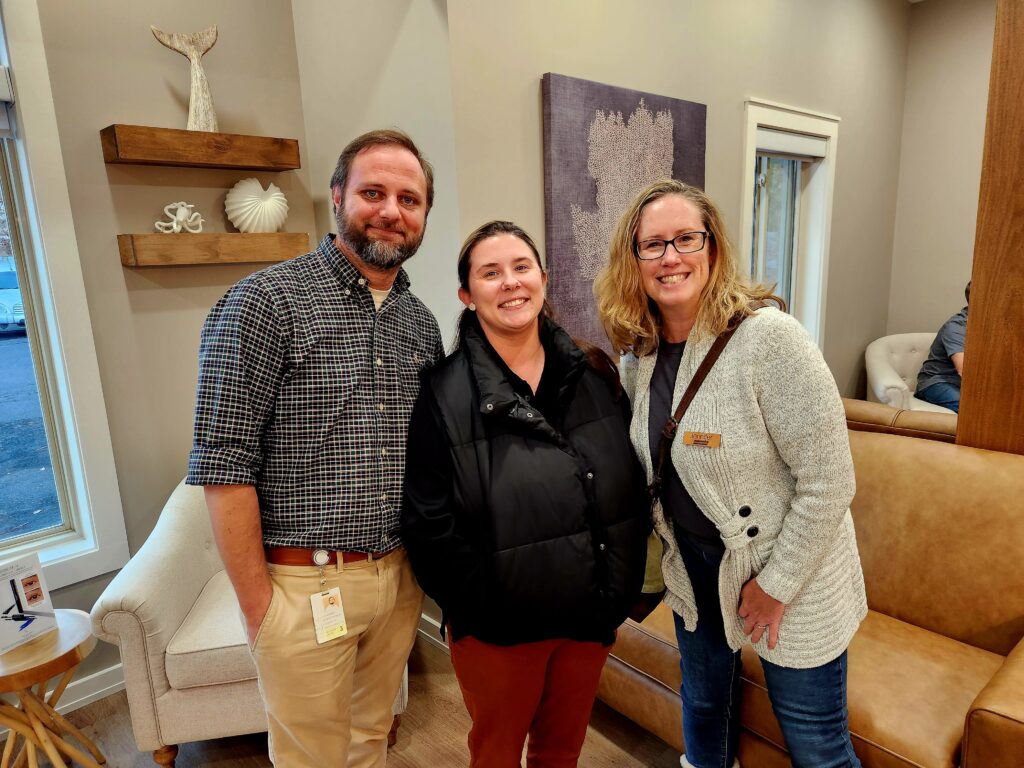 Group of 3 people at the ribbon cutting