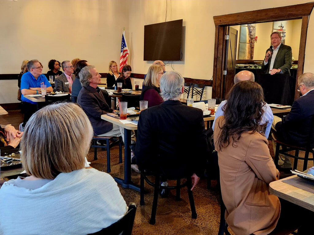 Group of people at a luncheon listening to the guest speaker