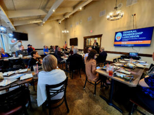 Group of people at a luncheon listening to the guest speaker