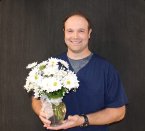 Ben Sabean Award Recipient Holding Flowers