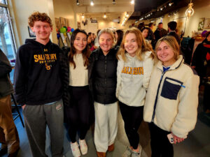 Group of ribbon cutting attendees inside PJs Coffee