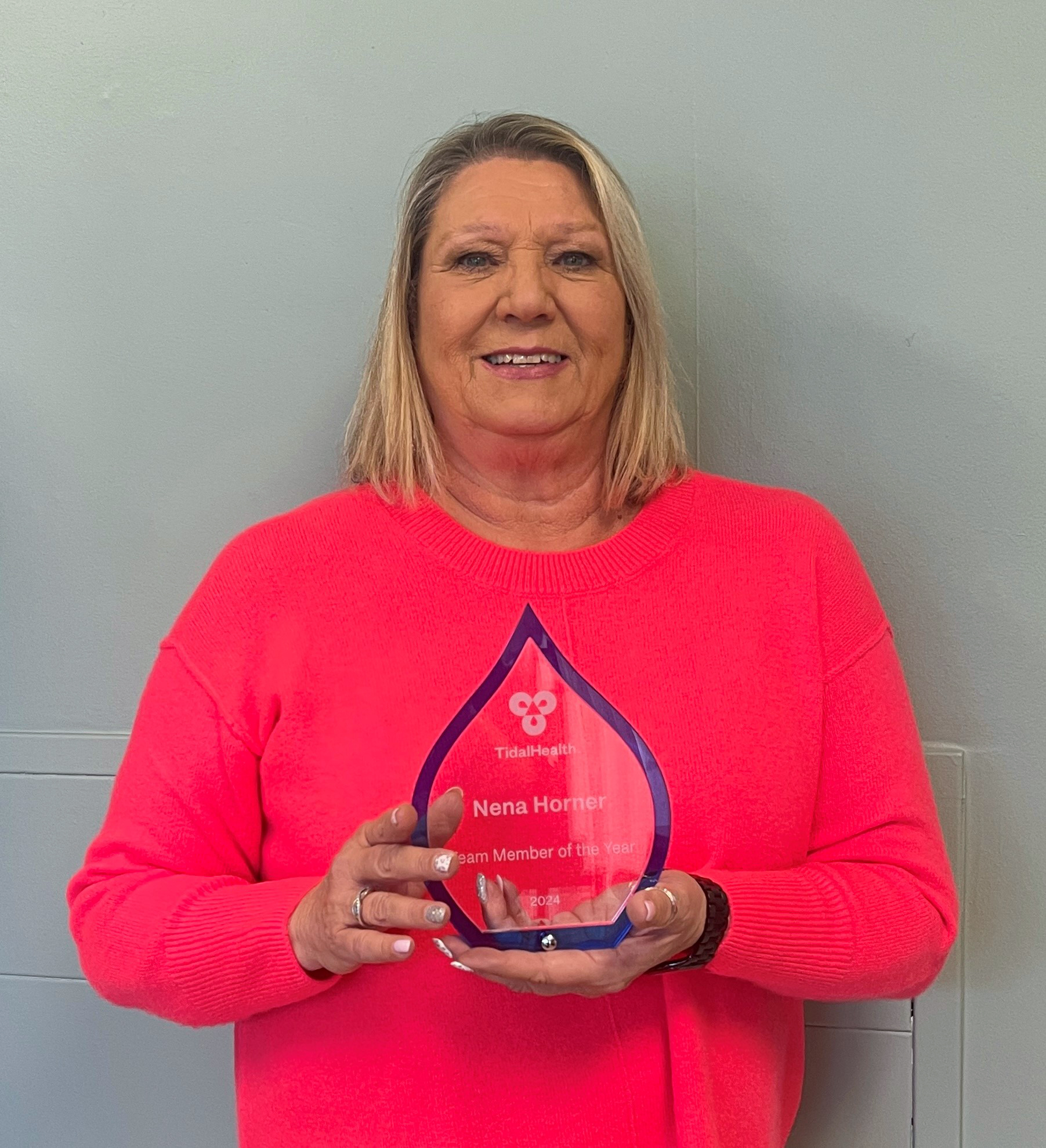 Woman holding an award