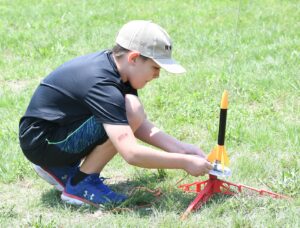 LAUNCHING ROCKETS_5581 Boy launching rocket
