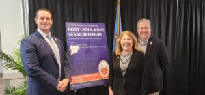 Moderator and SACC Board Chair Zach Evans, Senator Mary Beth Carozza, and SACC President & CEO Bill Chambers