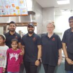 L-R Owners Priyanka and Paul Patel, with their daughters and staff