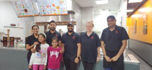 L-R Owners Priyanka and Paul Patel, with their daughters and staff