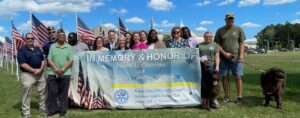 2025 flags for heroes takedown group of people holding up a flag