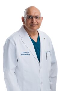 Dr. Gupta Tidal Health A doctor smiling for his portrait