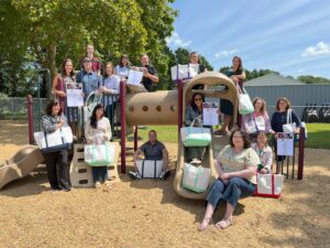 Salisbusy Christian A group of people holding bags