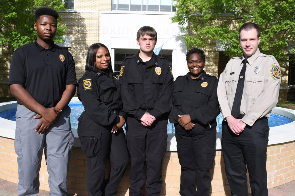 Group of individuals in police uniforms.