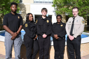 uppershore-graduates Group of individuals in police uniforms.