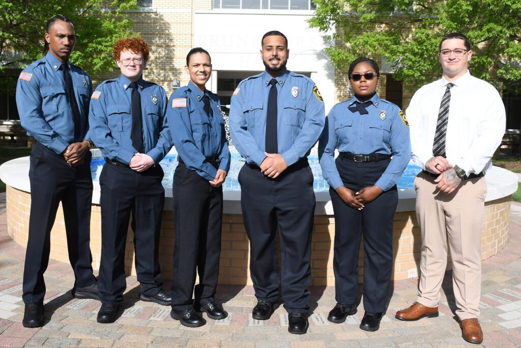 A group of individuals in police uniform
