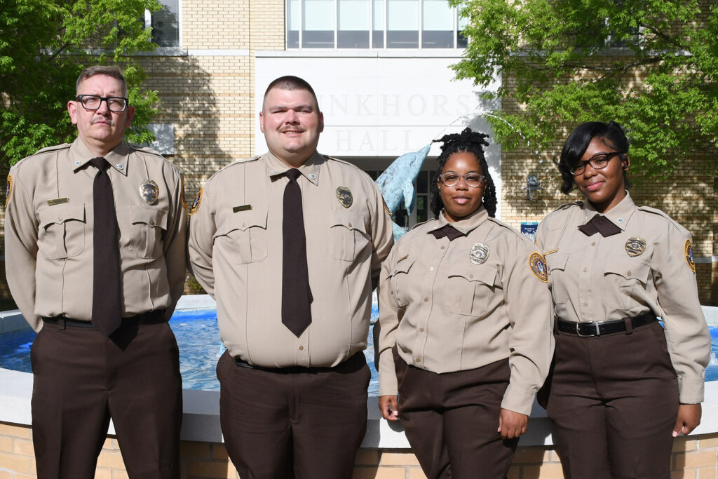 A group of individuals in police uniform