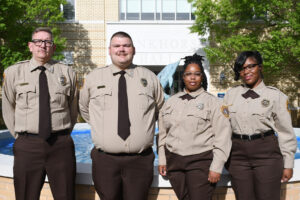 A group of individuals in police uniform