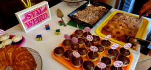 Cupcakes and other dishes at a ribbon cutting.