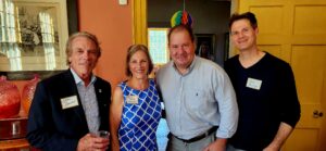 A group of individuals at a ribbon cutting.