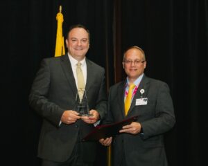 Dr. Trudy Hall, TidalHealth presented the MEmber Volunteer Award to David Livingston, Livingston Wealth Management