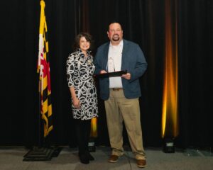 Jacqueline Jennings, Piedmont Airlines presented the Business Professional of the Year Award to Chris Bitters, Delmarva Shorebirds.