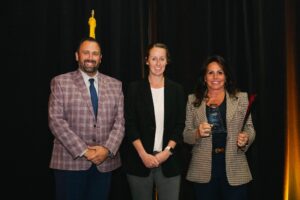 Justin Polizzi and Laura Soper present Tourism Business of the Year to Pohanka Automotive Group of Salisbury, accepted by Sandy Angello