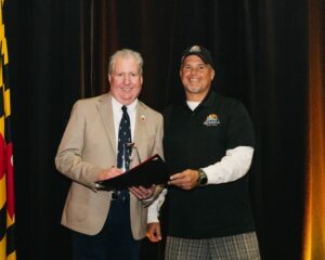 Tony Rayne, Seagull Disposal presented the Environmental Service Award to Nautilus Solar (accepted by Bill Chambers)