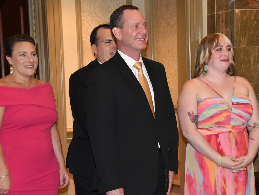 Teachers of the year finalists standing in dressed up attire.