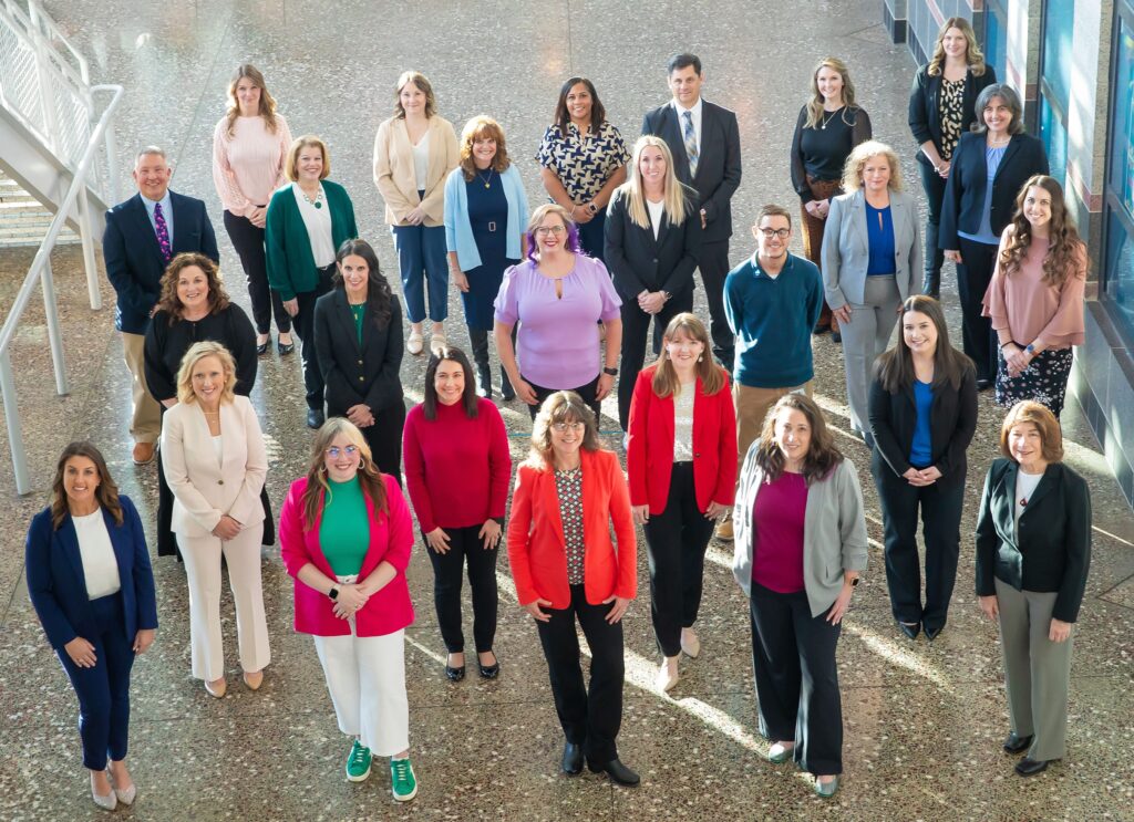 A group of people standing for their picture.