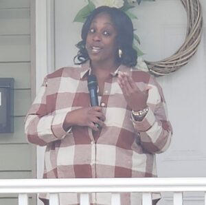 Habitat for Humanity of Wicomico County Celebrates Home Dedication for the Lofland Family A woman speaking with a mircophone.
