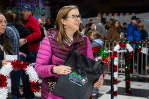 Black Friday | Jolly Rogers A woman holding a Jolly Rogers gift bag.