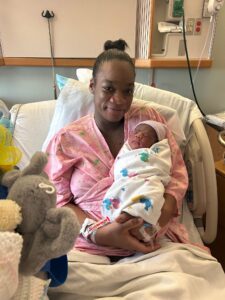 Mom holding the first baby of 2026.