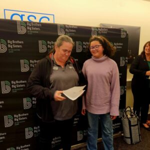 Big sister and little sister match smiling