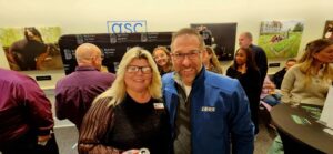 Two guests smiling for a photo