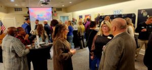 Three guests talking at event