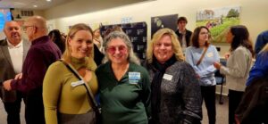 Three guests smiling for a photo
