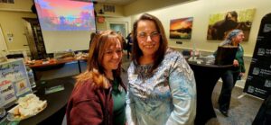 Two guests smiling for a photo