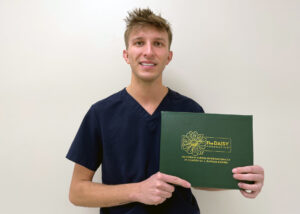 A man holding a certication