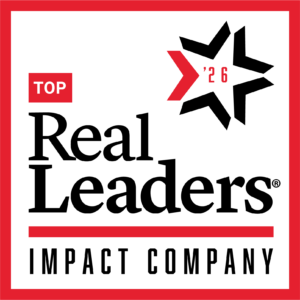 Photo with red and black text reading " Top Real Leaders Impact Company"