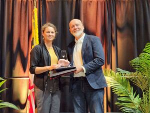 Kevin Dennis of Perdue Farms presents Jessica Flores of the Mill of Salisbury with the Agriculture Ambassador of the Year Award (1)